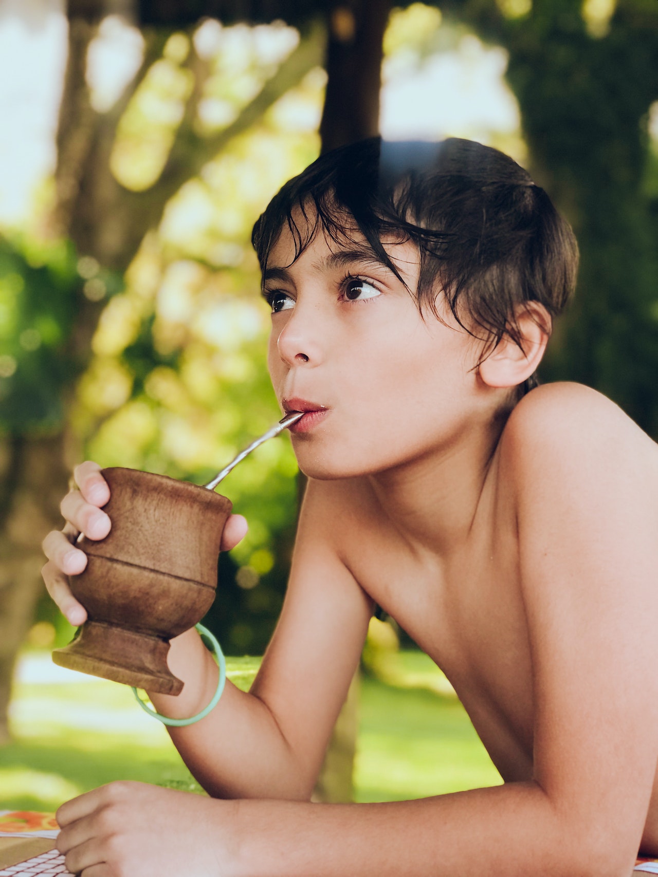 Young man drinking yerba mate from a matero