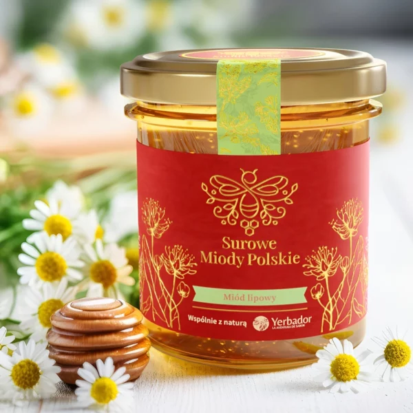 Jar of Yerbador Raw Linden Honey among chamomiles, next to a wooden honey dipper
