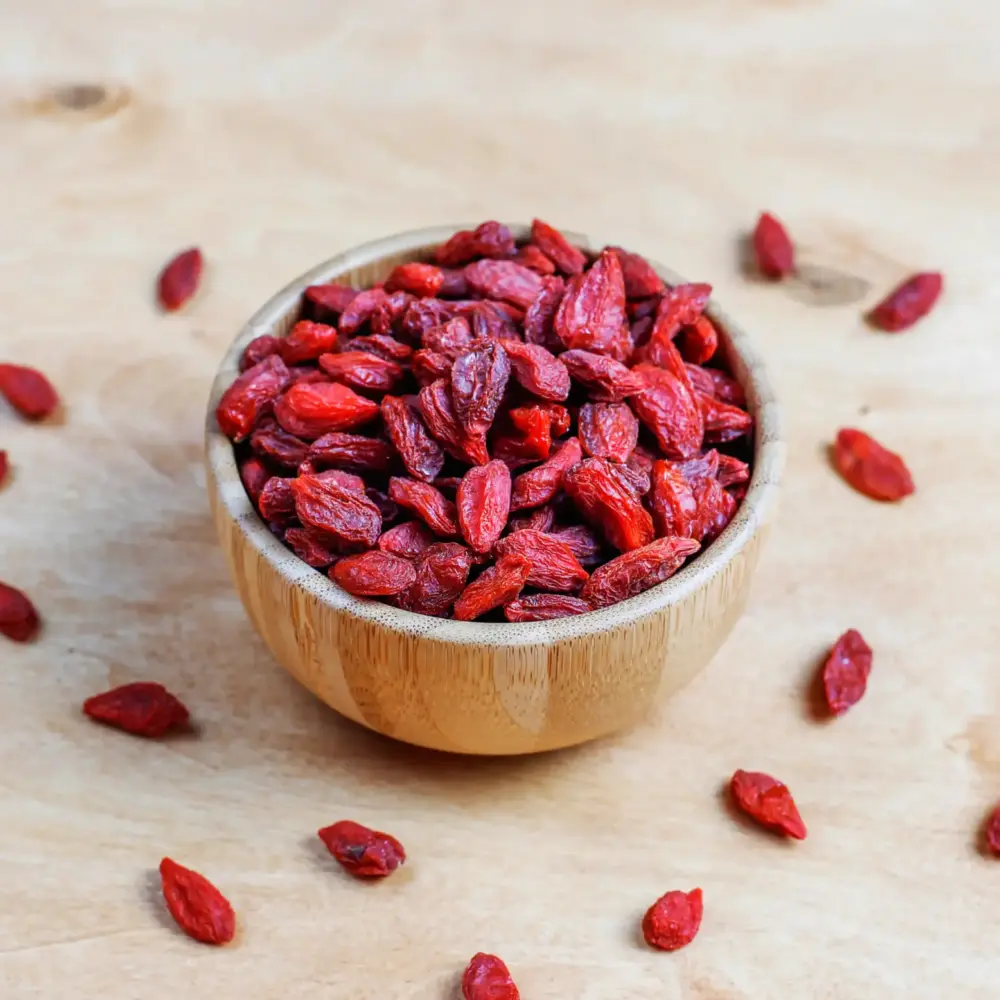 goji (2) Dried goji berries in a wooden bowl, macro