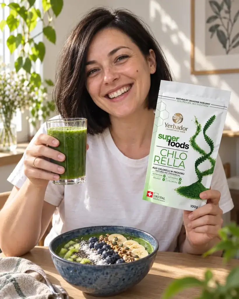 Laughing woman with a green smoothie, a bowl and chlorella package