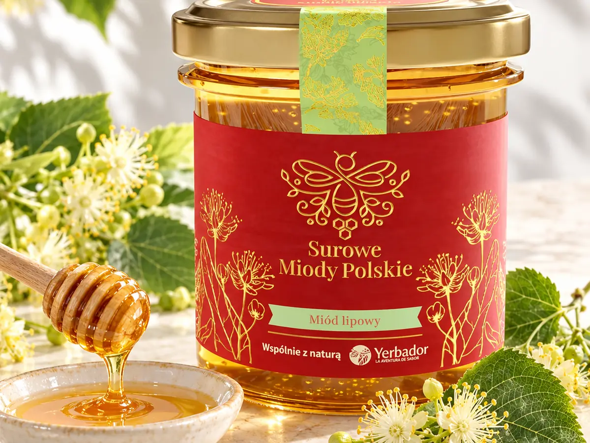 Jar of Yerbador linden honey with honey dripping from a spoon into a bowl