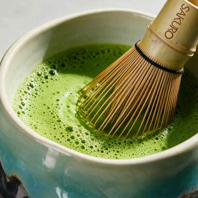 A chasen whisking matcha in a bowl — the three-minute preparation ritual A chasen whisking matcha in a bowl — the three-minute preparation ritual
