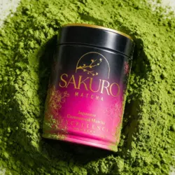 Sakuro Matcha Excellence 40 g tin next to a mound of vivid green ceremonial matcha